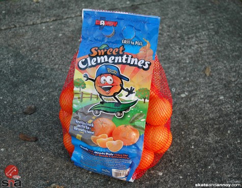 Dandy Dude the Clementine Orange, riding a skateboard